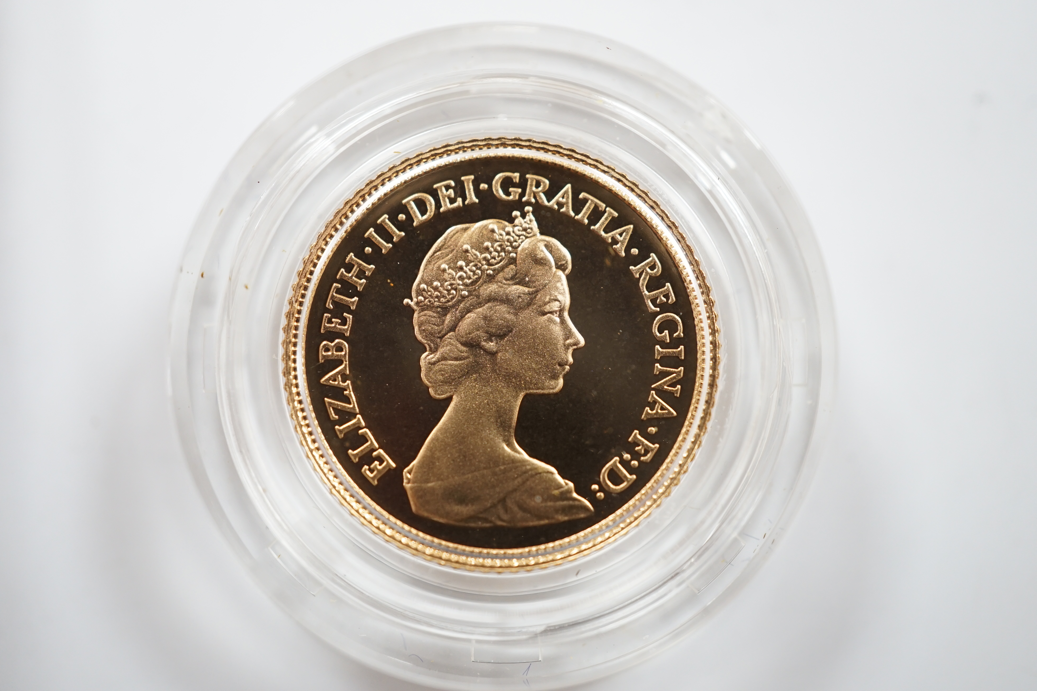 British gold coins, Elizabeth II, 1980 gold sovereign in case of issue, BUNC and a 1982 gold proof half sovereign, in case of issue with certificate